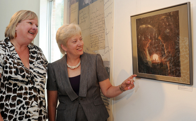 Lithuanian art. Ruta Klicius (left) and Lithuania’s Ambassador to Canada, H.E. Ginte Damusis, view one of the paintings included in the Lithuanian Museum’s exhibition showcasing the works of Mikalojus Konstantinas Ciurlionis. Staff photo by Fred Loek.